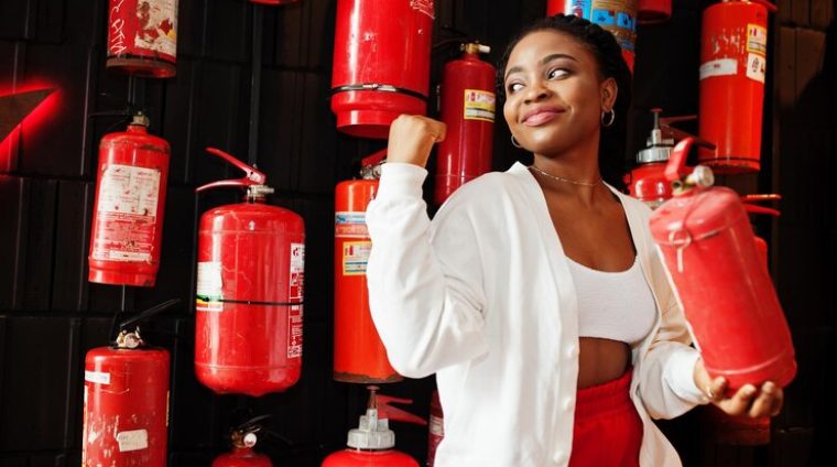 african-woman-posed-against-wall-with-old-extinguisher_627829-12292 (1)