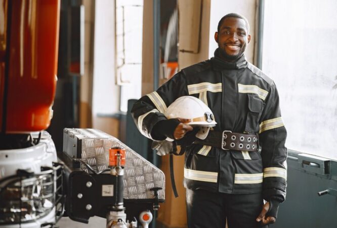 portrait-firefighter-standing-front-fire-engine_1157-46922