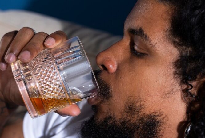 side-view-man-drinking-alcohol_23-2149699066