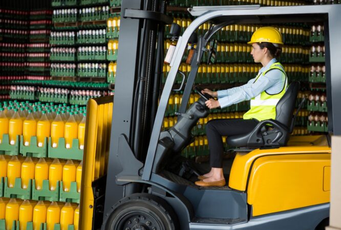 confident-female-worker-driving-forklift-warehouse_107420-96569