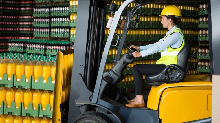 confident-female-worker-driving-forklift-warehouse_107420-96569