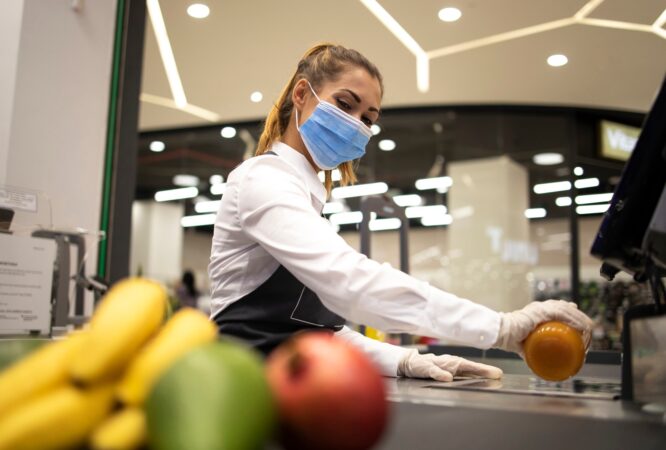 female-cashier-supermarket-wearing-hygienic-protection-mask-gloves-while-working-risky-job-because-corona-virus-pandemic_342744-1076