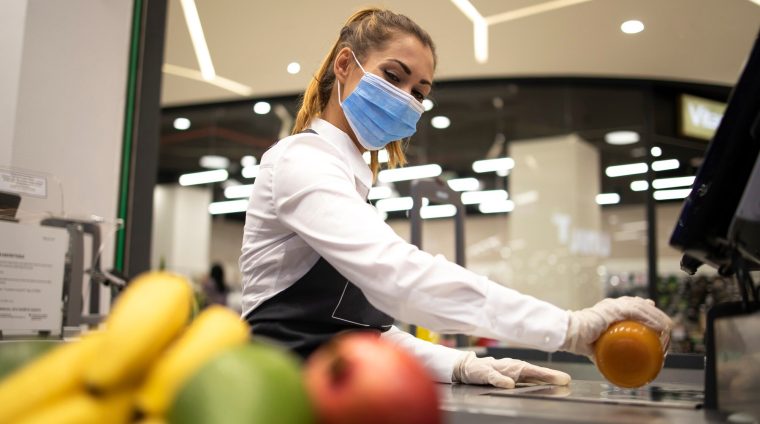 female-cashier-supermarket-wearing-hygienic-protection-mask-gloves-while-working-risky-job-because-corona-virus-pandemic_342744-1076