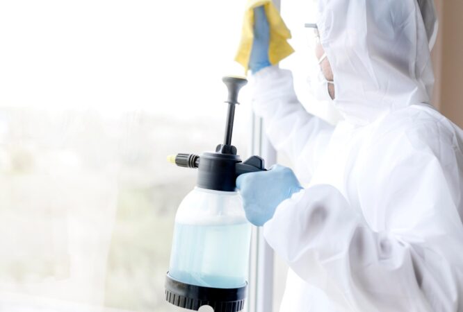 side-view-man-disinfecting-window_23-2148563404