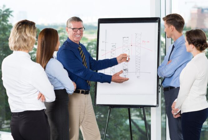 smiling-speaker-explaining-bar-chart-audience_1262-2003